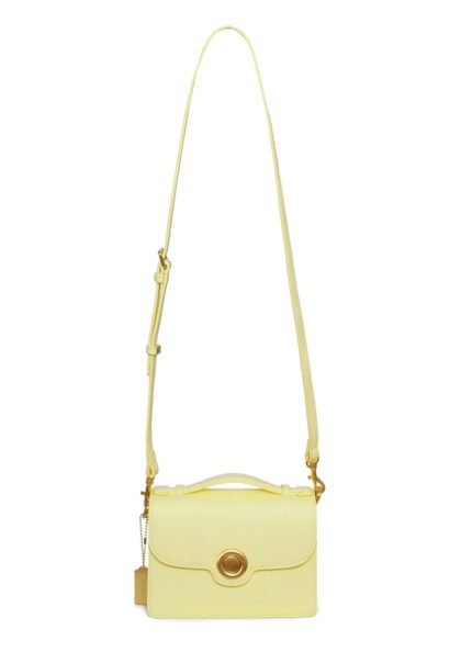 Nice yellow small crossbody bag in a white background